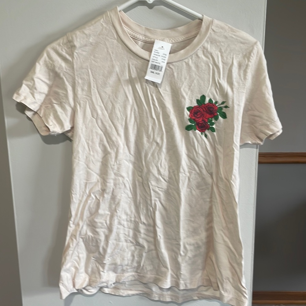 New T-shirt. PAC sun cream color with rose
